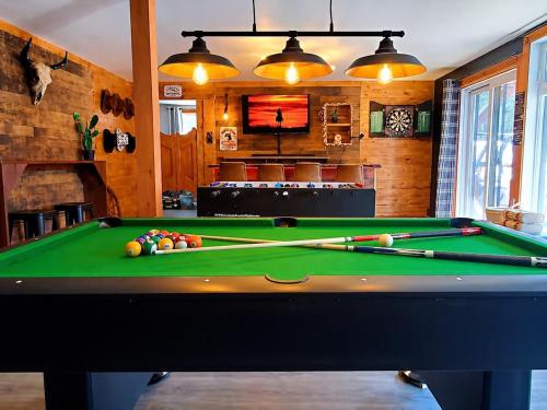 a billiard room with a pool table in a house at The Western Spa Sauna Bar & Billiards in Valcartier Station