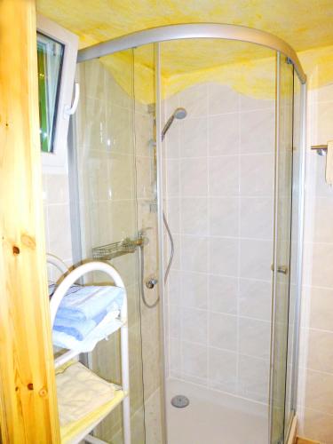 a shower with a glass door in a bathroom at Villa-Hufeland in Berlin