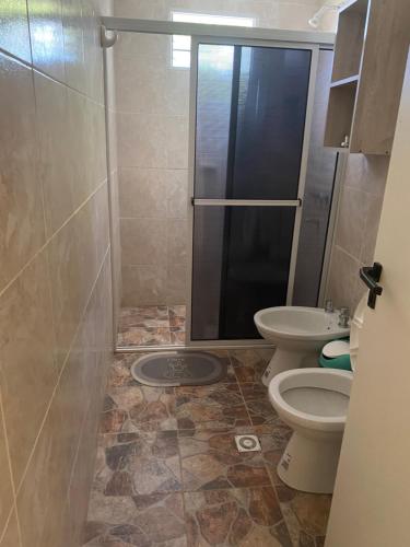 a bathroom with a shower and a toilet at Departamentos Belgrano in San Luis