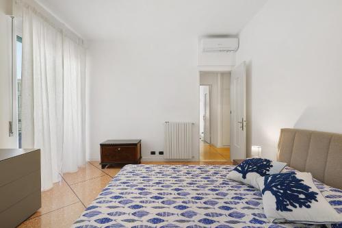 a bedroom with a bed with two pillows on it at Beautifulliguria in Sestri Levante