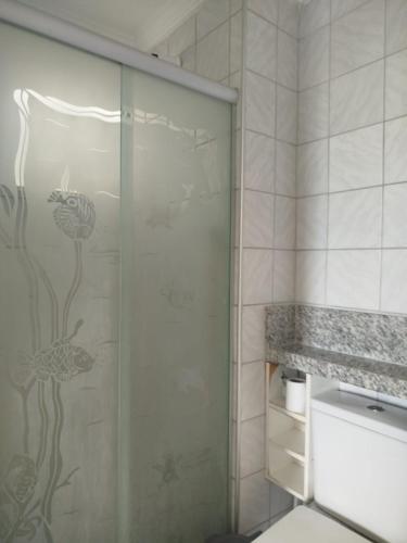 a bathroom with a shower with a glass door at Apto Amplo 3 quartos com lazer e bem localizado in Aracaju
