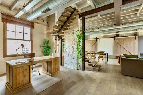 an office with a desk and a table at City Loft I Fireplace I Free Parking I Garden Bath in Nieuwpoort