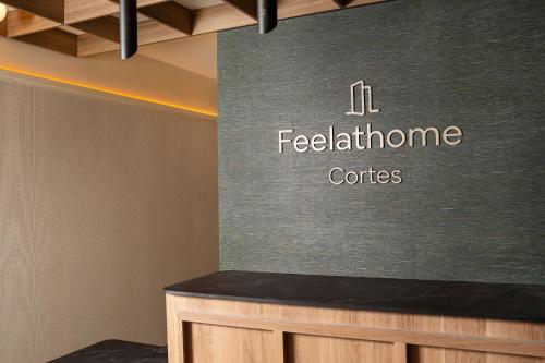 a sign for a conference room with a table at Feelathome Cortes in Madrid