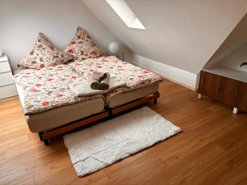 a bedroom with a bed with shoes on it at Stuttgart Nest in Stuttgart