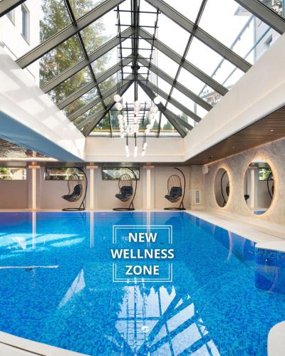a large swimming pool with a glass ceiling at Hotel Haffner Resort & Spa - Destigo Hotels in Sopot