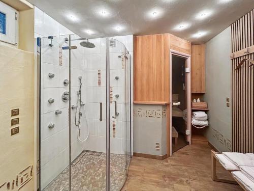 a bathroom with a shower with a glass door at Haus Farbenklang in Zwiesel