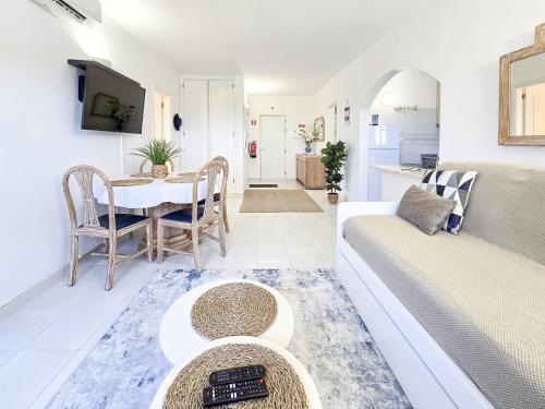 a living room with a couch and a table at Apartment Praia Rocha River-Sea in Portimão