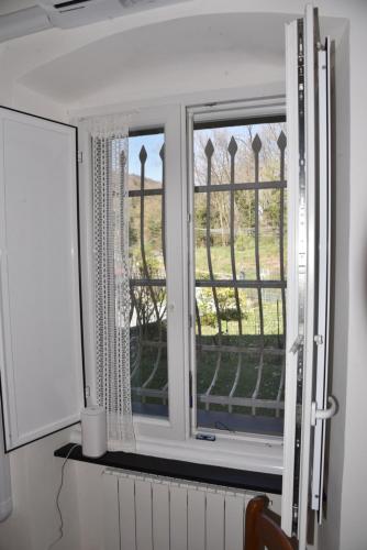 a window in a room with a view of a yard at Il Castello di Scoffera in Moranego