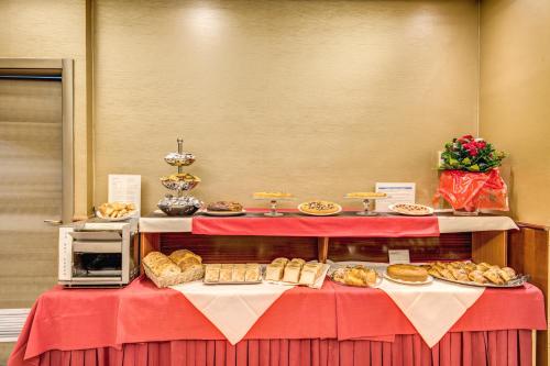 a table topped with lots of different types of food at Augusta Lucilla Palace in Rome