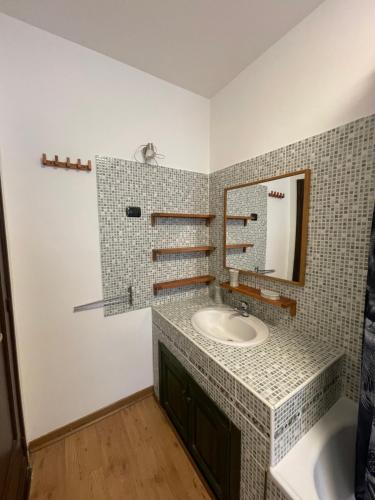 a bathroom with a sink and a mirror at maison du cinemà in Turin