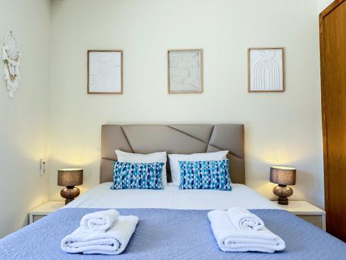 a bedroom with a bed with towels on it at Tavira Escape with Pool by BeCherish in Tavira