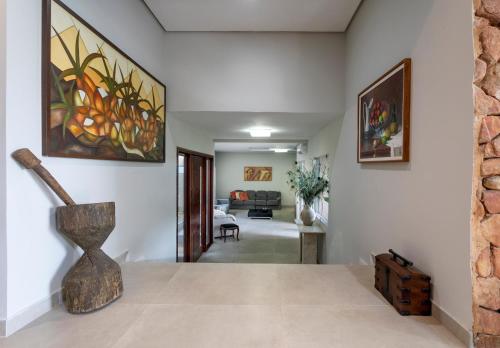a living room with a vase on a table at Haras Ammi Shaddai in Cuitegi