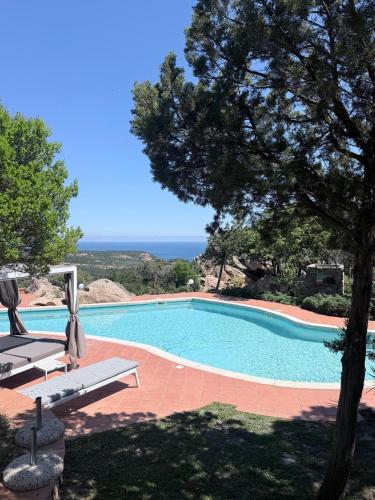 a swimming pool with a view of the ocean at Villa Esmerea Portocervo con Piscina privata ,Jacuzi e Sauna in Porto Cervo