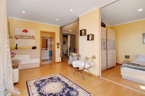 a bedroom with a bed and a mirror at Casa Carreira in Ponta do Sol