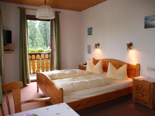 Postel nebo postele na pokoji v ubytování Gasthaus Schweizerhof
