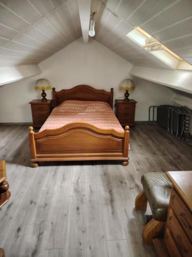 a bedroom with a bed and a couch in a room at VIDAL BERNARD in Saint-André-de-Vézines