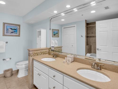 a bathroom with two sinks and a toilet at Sandestin Golf and Beach Resort in Destin