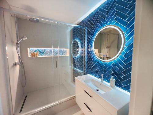 a bathroom with a shower and a sink and a mirror at Base Camp - Apartmán Klínovec in Kovářská