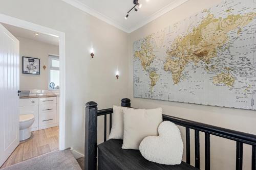 a room with a map of the world on the wall at Panoramic Sunset Views - Free Parking & Sleeps 5 in Heywood