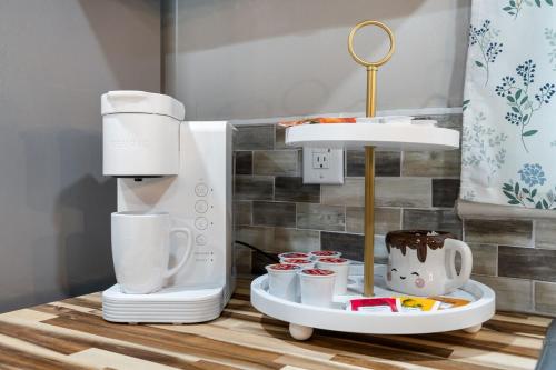 a kitchen counter with a coffee maker and a mixer at Nostalgic In Norwood in Birmingham
