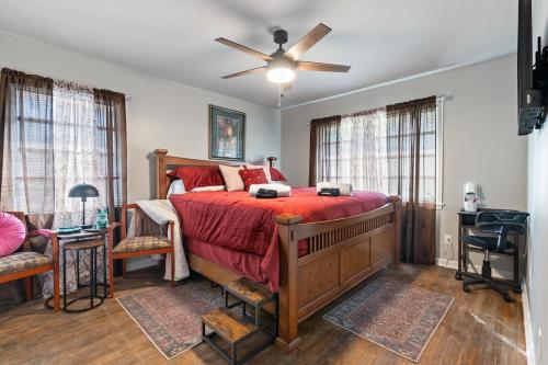 a bedroom with a bed and a ceiling fan at Nostalgic In Norwood in Birmingham