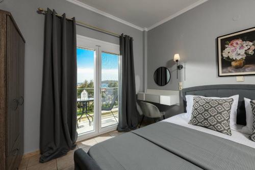 a bedroom with a bed and a view of a balcony at Dimitreli Venetia Studios in Koinyra
