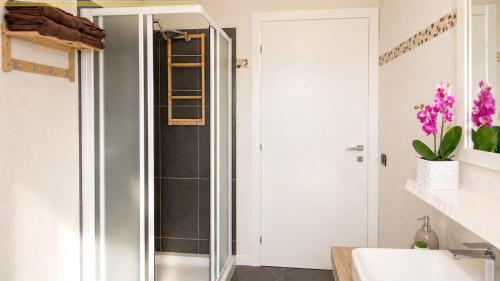 a bathroom with a shower and a sink at This is my happy place in Leggiuno