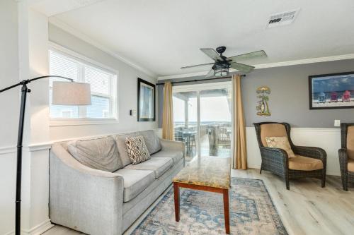 a living room with a couch and a table at Beachfront - Private Walkover to Beach in Surfside Beach