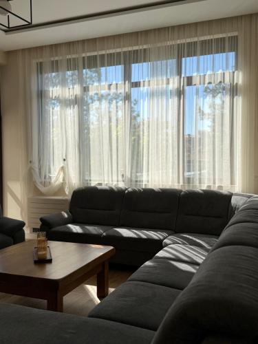 a living room with a couch and a table at Easy Stay in Karlovo
