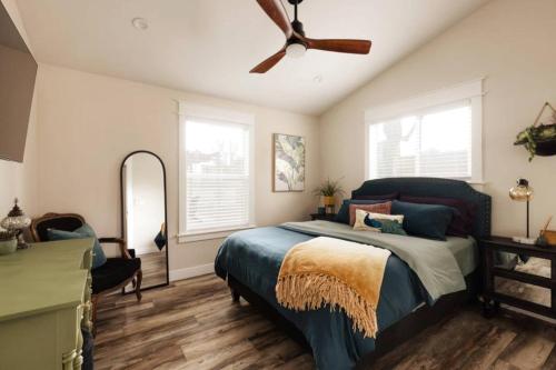 a bedroom with a bed and a ceiling fan at Charming Home Downtown Paso Robles in Paso Robles