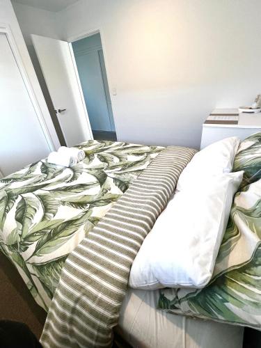 an unmade bed in a small room with a sqor at Room and Private Bathroom in Woodend in Woodend
