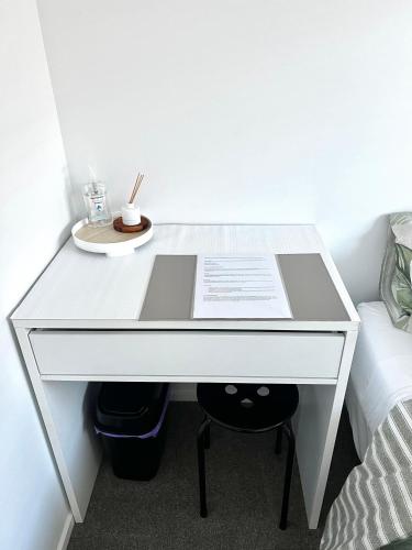 a white desk in a room with a bed at Room and Private Bathroom in Woodend in Woodend