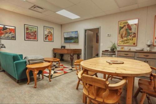 a conference room with a table and chairs and a table and a table at The Big Red Barn in Whitehorse