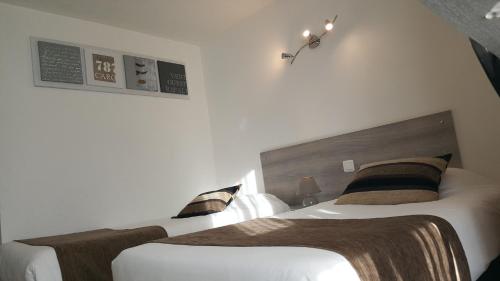 Postel nebo postele na pokoji v ubytování Hôtel Eclipse