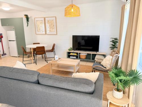 a living room with a couch and a table at 'Your Place on Davidson' in Mount Isa