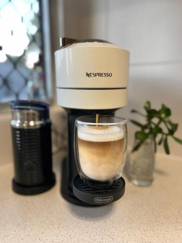 a coffee maker sitting on a counter with a cup of coffee at Another 'Your Place on Davidson!' in Mount Isa