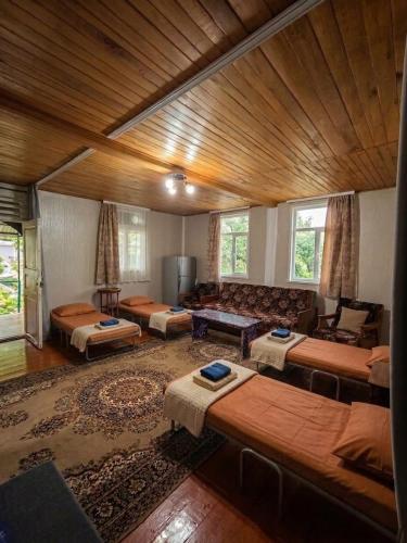 a large living room with a couch and a table at Guest house VL in Alaverdi