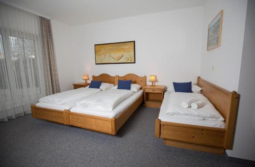 Llit o llits en una habitació de Grandhotel Niederösterreichischer Hof