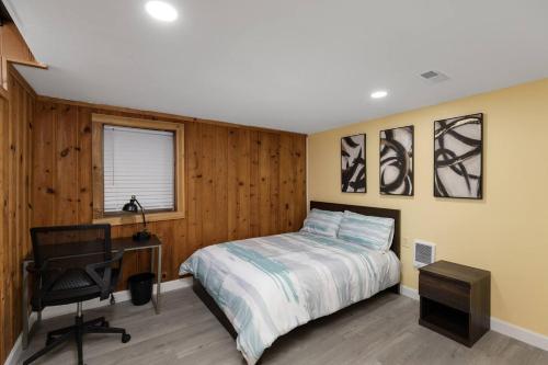 a bedroom with a bed and a desk and a chair at Gn4 - Sleek Private Room Ideal for Remote Work, Wi-Fi, Free Parking in Beech