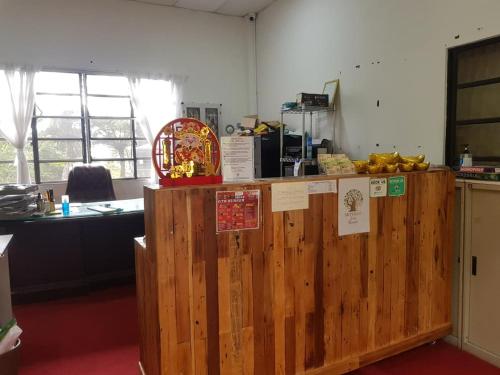 a wooden counter in a room with bananas on it at Skyville Zen Resort,Kundasang in Kampong Kundassan