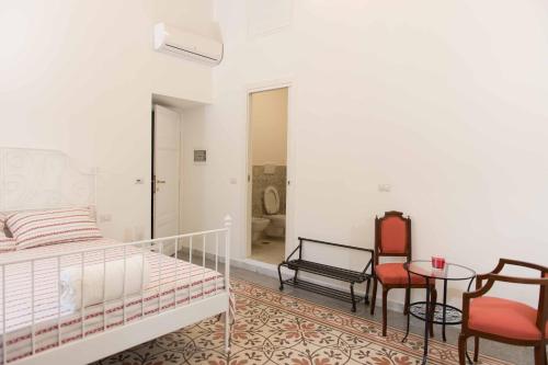 Postel nebo postele na pokoji v ubytování B&B Domus Aurea