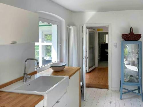 a kitchen with a sink and a bowl on a counter at House Between Forest And Fields In Brandenburg in Casekow