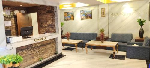 a lobby with a waiting room with couches and a tv at Katson Blue Dalhousie in Dalhousie