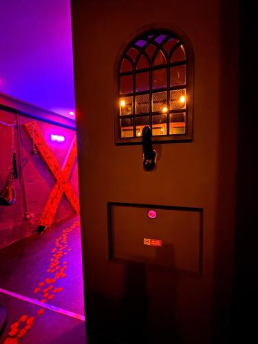 a door with a window and lights on it at Suite XOXO in Souppes-sur-Loing
