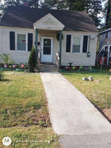 a house with a sidewalk leading to the front door at open arms in Elizabeth City