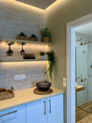 a kitchen with a counter with a bowl on a counter sidx sidx sidx at Zoe’s sea view in Pylos