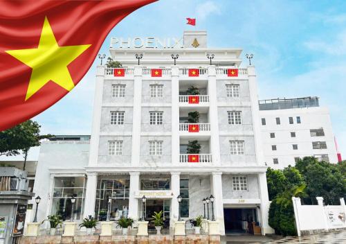 a building with a flag in front of it at Phoenix Hotel Vung Tau in Vung Tau