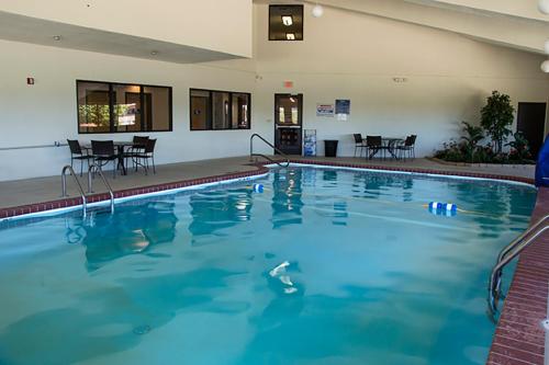 a large swimming pool with blue water in a hotel at Greenlight Inn & Suites St James in Saint James