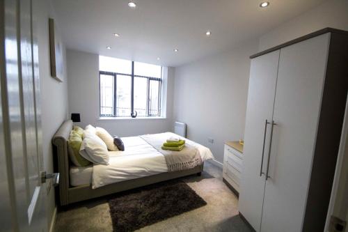 a small bedroom with a bed and a window at StayZo Spacious Self-Catering Accommodation-3 in Bradford