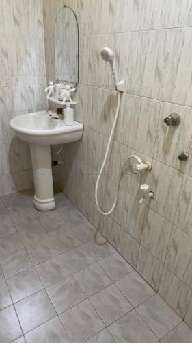 a bathroom with a sink and a shower at Romance in Bay in Arugam Bay